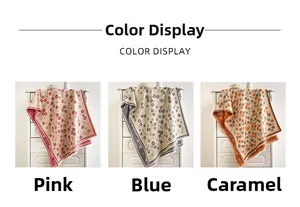 Detailed color display of floral cashmere-feel scarves in pink, blue, and caramel shades