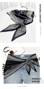 Detail of paisley print imitation cashmere scarf styled as a versatile waist wrap accessory