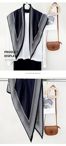 Detail of navy blue imitation cashmere scarf with white bohemian geometric pattern print