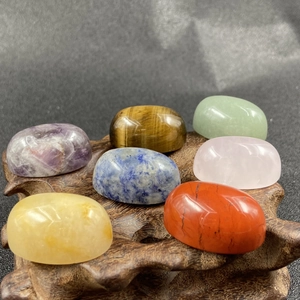 Polished 7 chakra natural stones with wood base, featuring amethyst and tiger eye