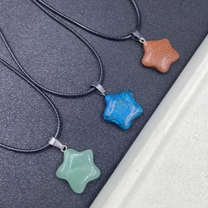 Star-shaped natural gemstone pendant necklaces in green, blue and brown with black cords
