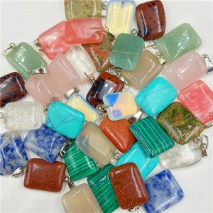 Detailed close-up of rectangle natural stone pendants in various colors and patterns