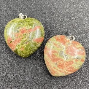 Macro shot of 30mm heart-shaped Unakite stone pendant with a silver metal clasp hook
