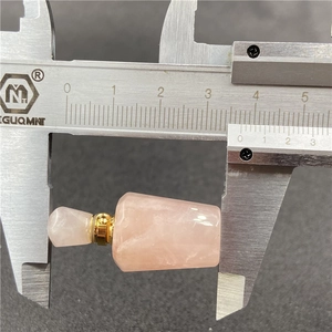 Rose quartz faceted perfume bottle necklace with measurement tool showing 3.5cm size