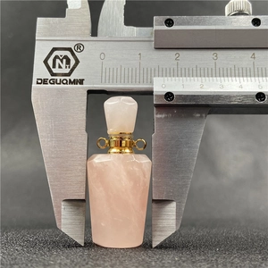 Rose quartz heart perfume bottle pendant with faceted crystal and gold metal trim