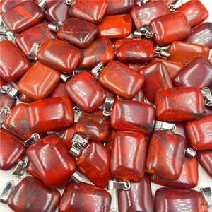 Close-up of rectangle red jasper natural stone pendants with silver metal clasps