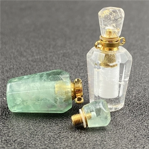 Faceted heart crystal perfume bottle necklace with golden metal cap in clear and green stone
