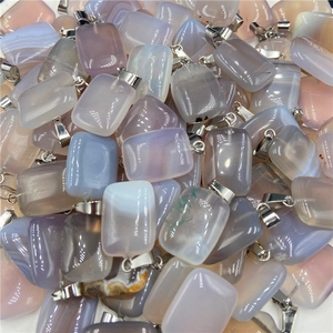 Macro shot of colorful rectangular natural agate pendant stones with silver clasps