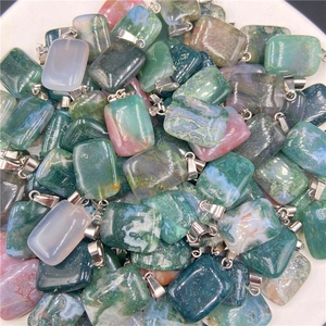 Macro shot of rectangular moss agate stone pendants with silver metal clasps