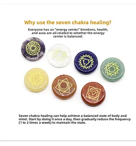 Macro detail of seven chakra energy stones with engraved gold symbols for yoga meditation