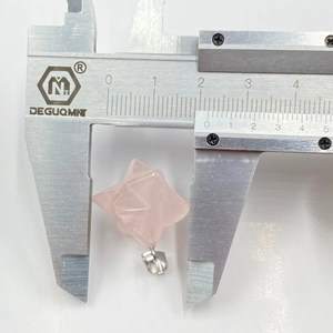 Macro shot of 20mm Rose Quartz Merkaba pendant showing precise star-shaped geometric cut