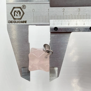Measuring 1.8cm rose quartz Merkaba pendant with caliper to show precise size scale
