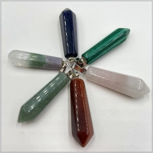 Macro view of six hexagonal stone pendants in various colors with silver metal clasps