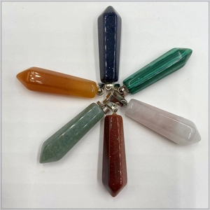 Assorted hexagonal crystal point pendants in diverse natural stone colors with metal clasps