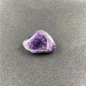 Polished Chevron Amethyst stone showing natural purple and white banded patterns