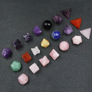 Detailed view of varied geometric natural crystal shapes in colorful polished gemstones
