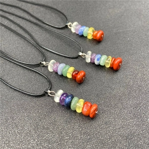 Detailed view of three seven chakra gemstone necklaces with colorful crystal beads