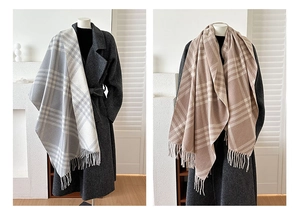 Detail view of double-sided plaid cashmere scarves with soft fringe and elegant tassels