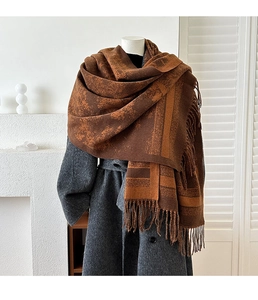 Detail of vintage jacquard scarf with geometric patterns and fringe edges for women