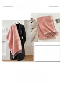 Detail of pink and white cat pattern cashmere-like winter scarf with soft fringe edges
