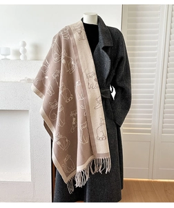 Detail of cute cat jacquard pattern and fringe on soft double-sided knit scarf