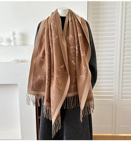 Detail of cute cat jacquard pattern and long fringe on thick cashmere-like scarf