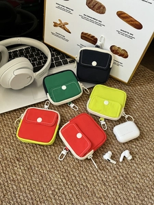 Detailed view of colorful canvas mini storage bags for earphones and small coins