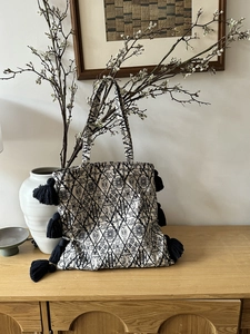 Bohemian heavy embroidery canvas tote bag with black tassels in home art setting