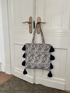 Ethnic canvas tote bag with black and white geometric embroidery and side fringe tassels