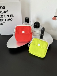 Portable mini canvas storage bag for earphones and coins with hanging hook in red and green