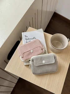 Mini storage pouch for data cables and coins in light grey and brick pink colors