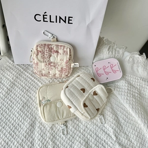 Quilted fabric earphone cases with floral patterns, zipper pockets and hanging hooks