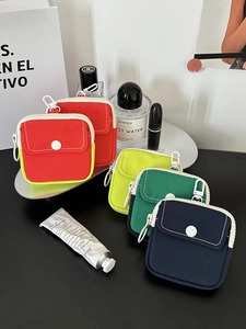 Portable mini canvas coin purse with white hook and dual pockets shown in four colors