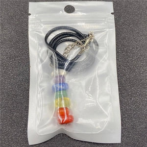 Seven chakra natural crystal stones necklace with black cord in transparent packaging