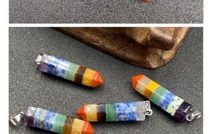 Macro detail of hexagonal 7 chakra crystal pendant showing layered natural stone textures