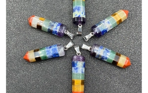 Radial arrangement of six hexagonal seven chakra healing crystal point pendants