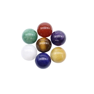 Healing chakra set with seven polished 16mm natural stone spheres in a floral layout