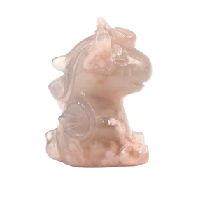 Natural cherry blossom agate hand-carved dragon figurine with translucent pink minerals