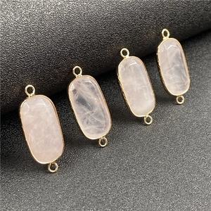 Rectangular rose quartz stone pendant with gold plating and double loops for jewelry