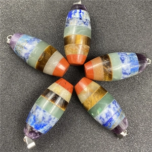 Detailed view of five hexagonal seven chakra crystal pendants arranged in a star pattern