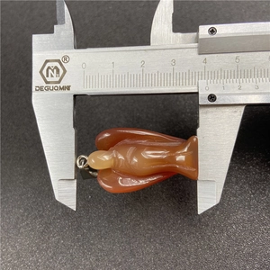 Natural red carnelian crystal angel pendant measured with a caliper for 35mm size