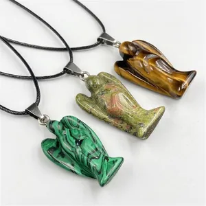 Three natural crystal angel pendants in tiger eye, unakite and malachite with black cords