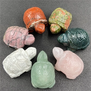Detailed set of seven hand-carved gemstone turtles in assorted natural minerals