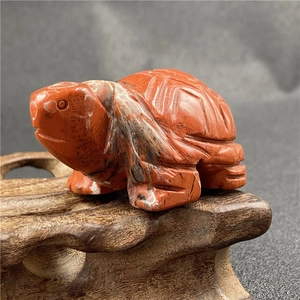 Detailed close-up of a 2-inch Red Jasper turtle carving showing natural mineral patterns