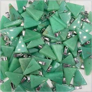Close-up of green crystal agate triangle pendants with silver clasps for jewelry making