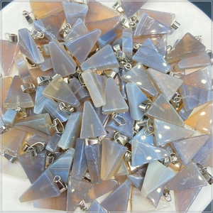 Macro view of triangular natural agate stone pendants with silver-colored metal bails