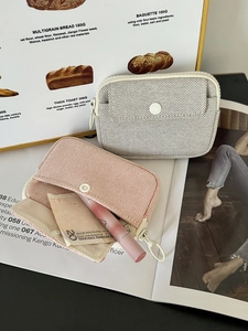 Portable mesh mini organizer bag for lipstick and cables in grey and peach pink colors