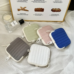 Quilted mini earphone pouch in multiple colors with hook for storage and keys