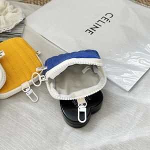 Quilted mini headphone pouch with carabiner in royal blue and ginger yellow colors