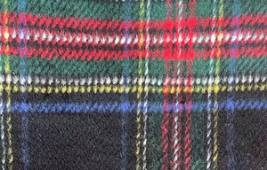 Close-up of thick multi-color plaid wool fabric with soft brushed fleece texture detail